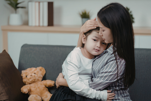 Child Support Raleigh, NC | Mother comforting daughter in home