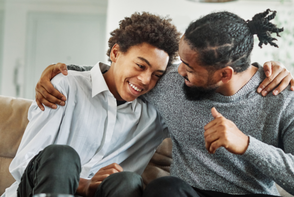 Dad and son laughing together