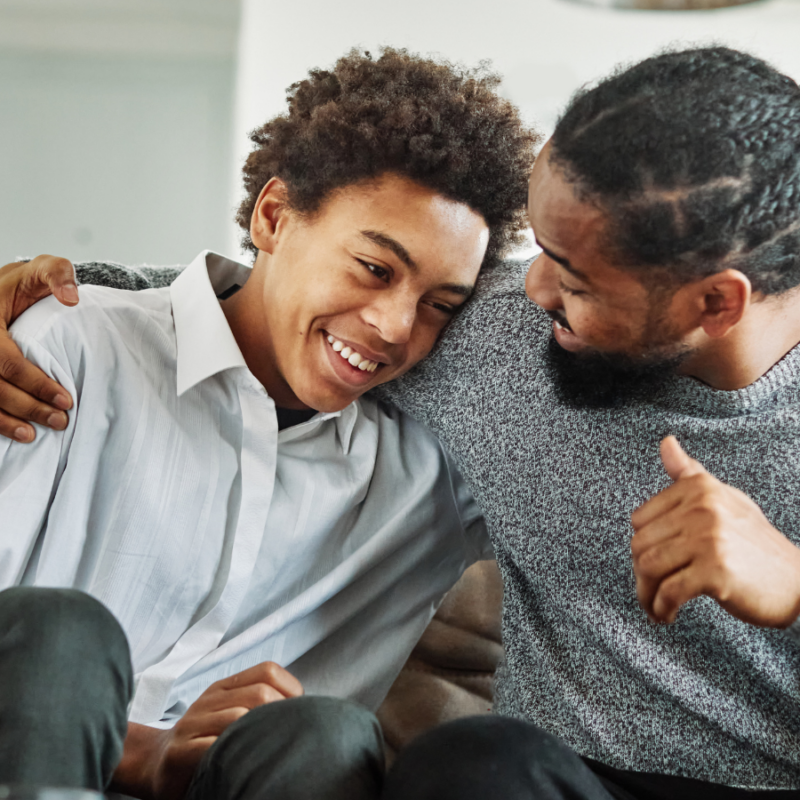 Dad and son laughing together