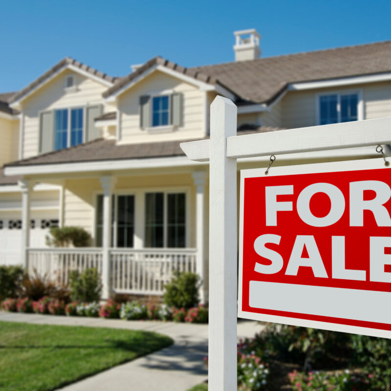 Home For Sale Sign in Front of New House.