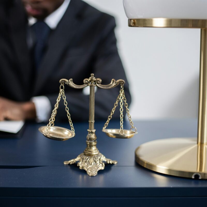 Attorney sitting at desk working on business divorce paperwork.