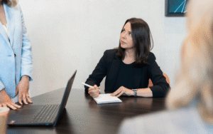 Attorney Sara Bolasny taking notes